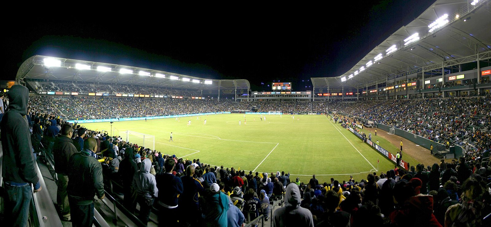 Soccer match under the lights with a full crowd